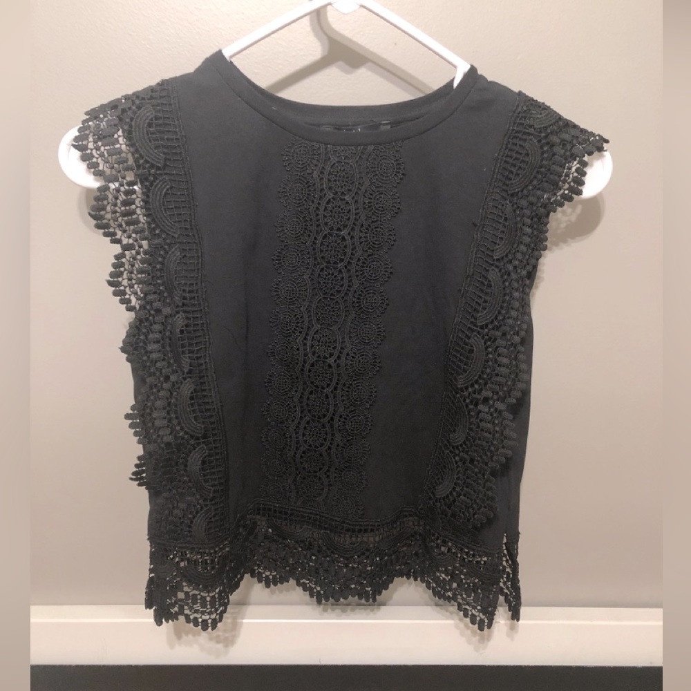 New with tags. Cotton black tank top with lace accents.